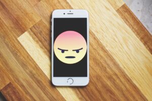 phone with angry emoji