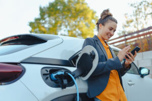 a cheery business person who has mastered electric vehicle road tax