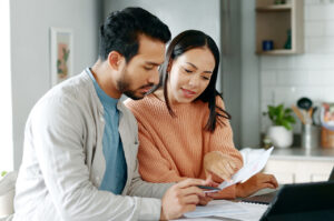 spouses going through their finances while discussing inheritance tax for married couples