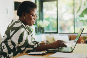a business owner researching enhanced capital allowances on a laptop