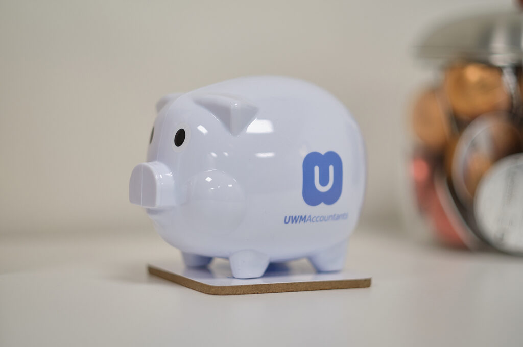 A piggy bank with the UWM Accountants logo displayed on the side