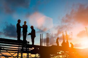 construction workers who have claimed a CIS refund and gotten tax back standing on some scaffolding against a setting sky